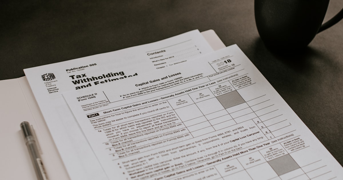 Tax forms comparing 1099 and W-2 deductions